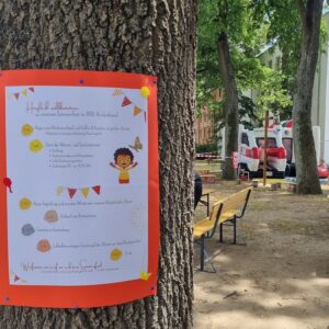 Ablaufplakat mit Hüpfburg beim Kita-Sommerfest